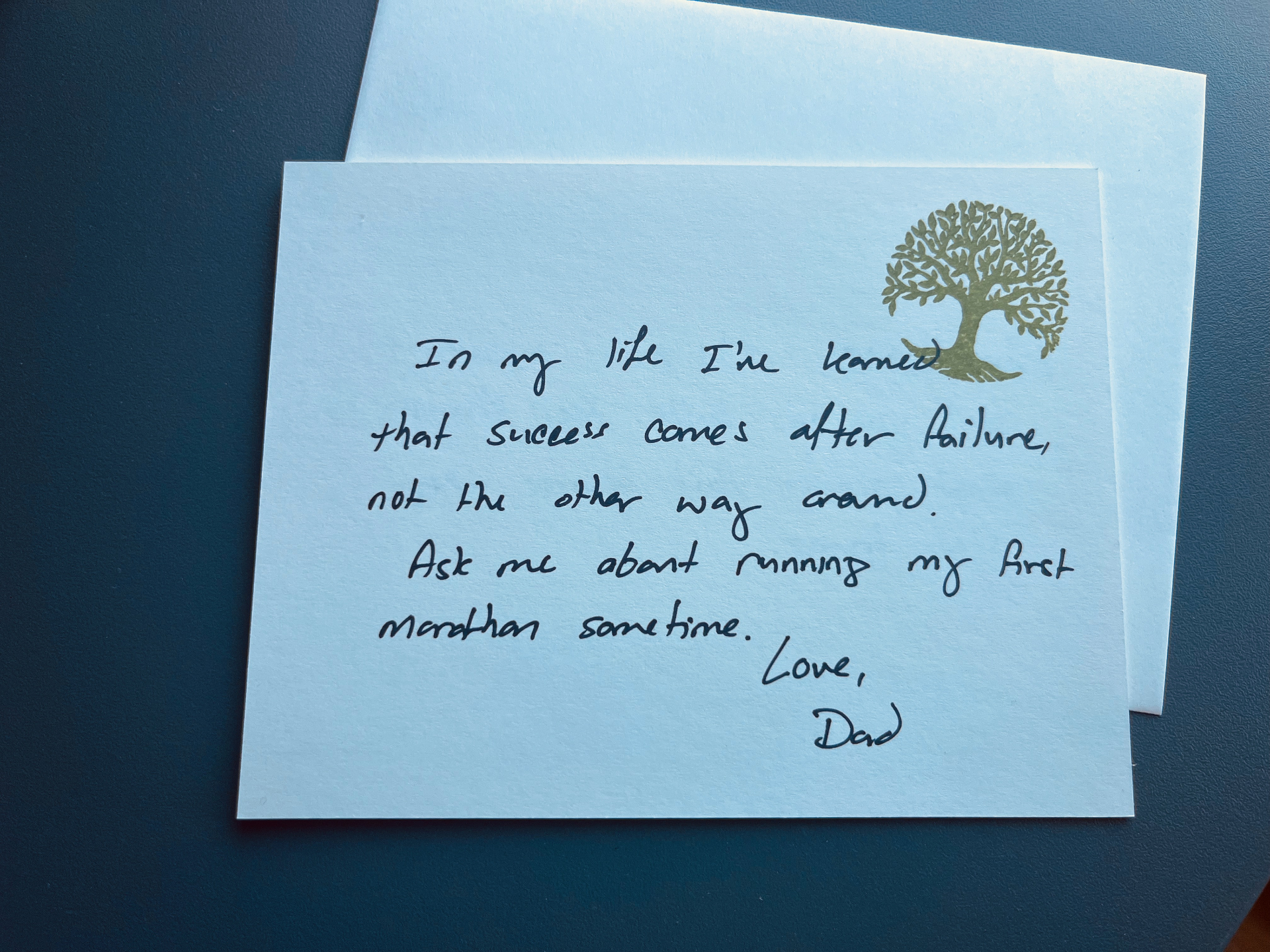 Back of one of the original handwritten cards, reading 'In my life I've learned that success comes after failure, not the other way around. Ask me about running my first marathon sometime. Love, Dad.'